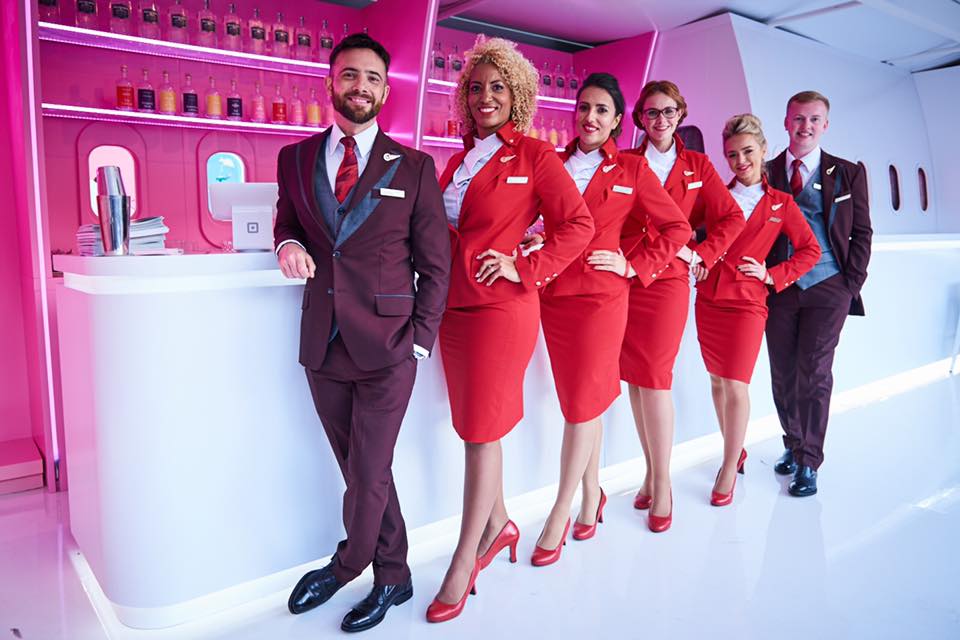 Virgin Atlantic employees in front of counter