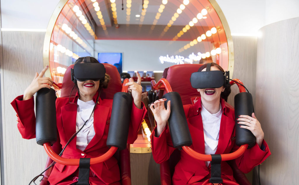 Two women trying out a virtual rollercoaster