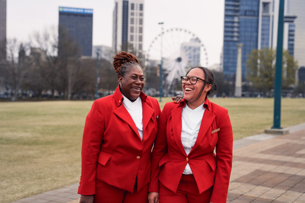 Two Virgin Atlantic employees laughing outside